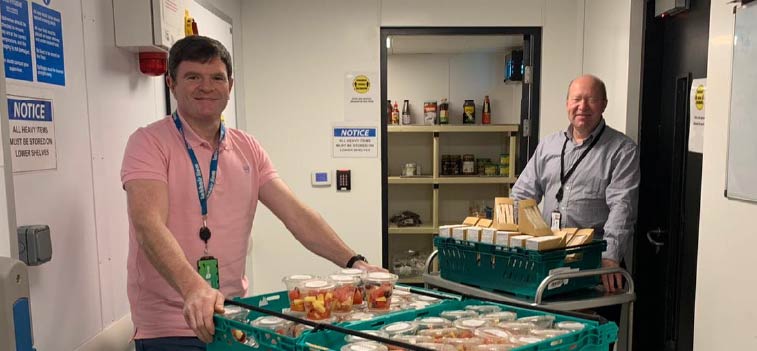 Catering team providing food parcel service Catering team providing food parcel service