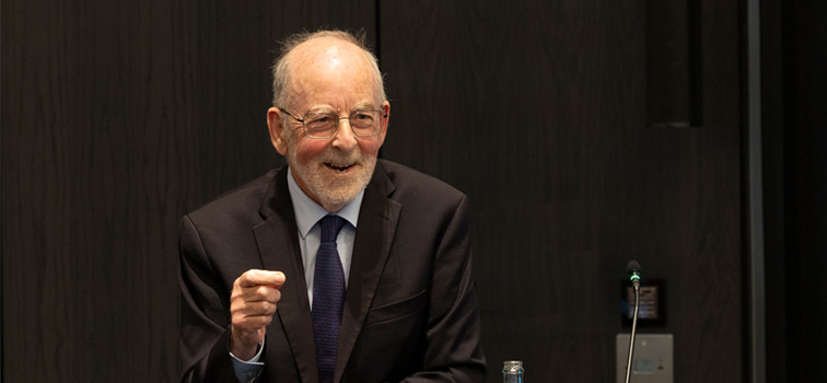 Patrick Honohan with dark background