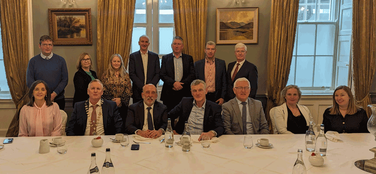 A large group of men and women at a table