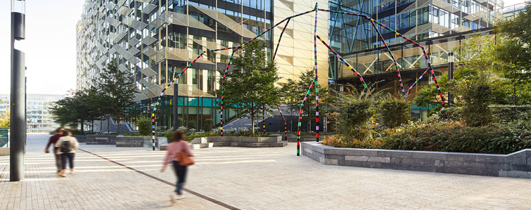 Annual Report 2022 A few people walking on pathway at Central Bank of Ireland building