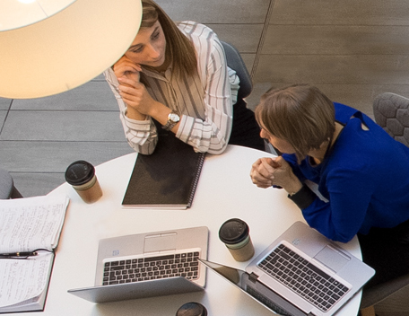 people-discussing-at-table-over-coffee